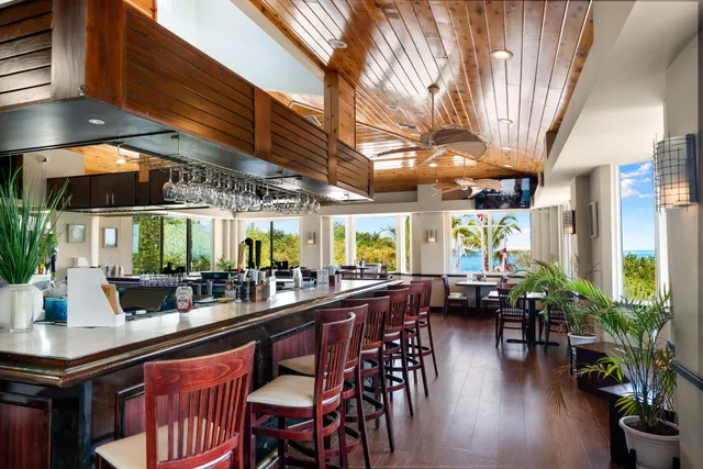 a kitchen with lots of counter top space and wooden floor