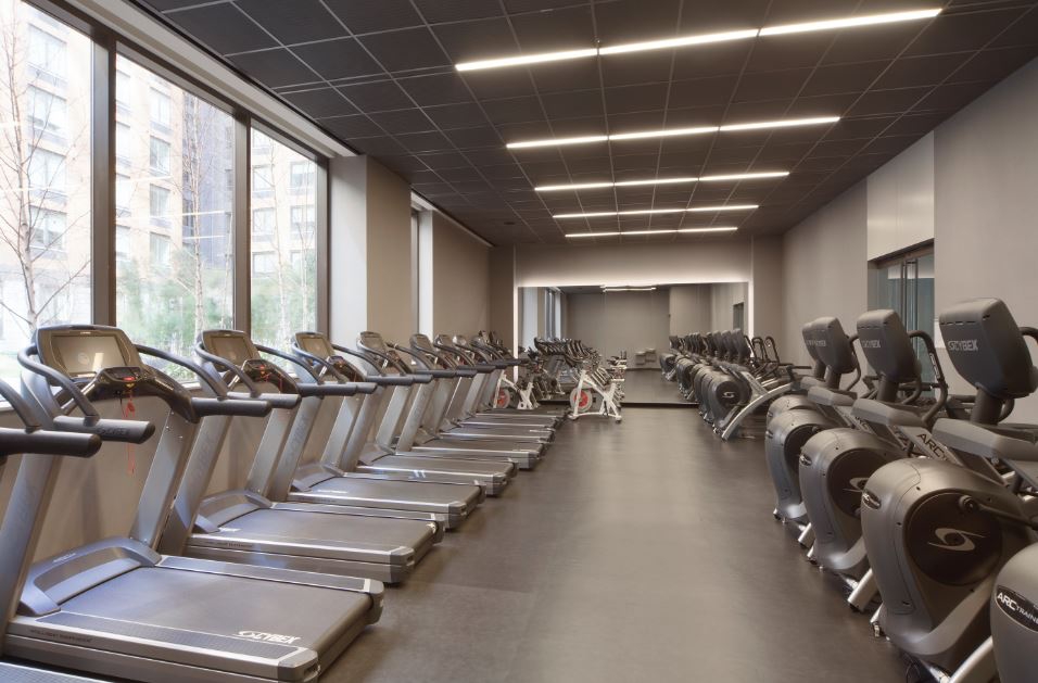 550 West 45th Street, Unit 2513 Manhattan, NY 10036 - Photo 12 of 22 a view of a room with gym equipment