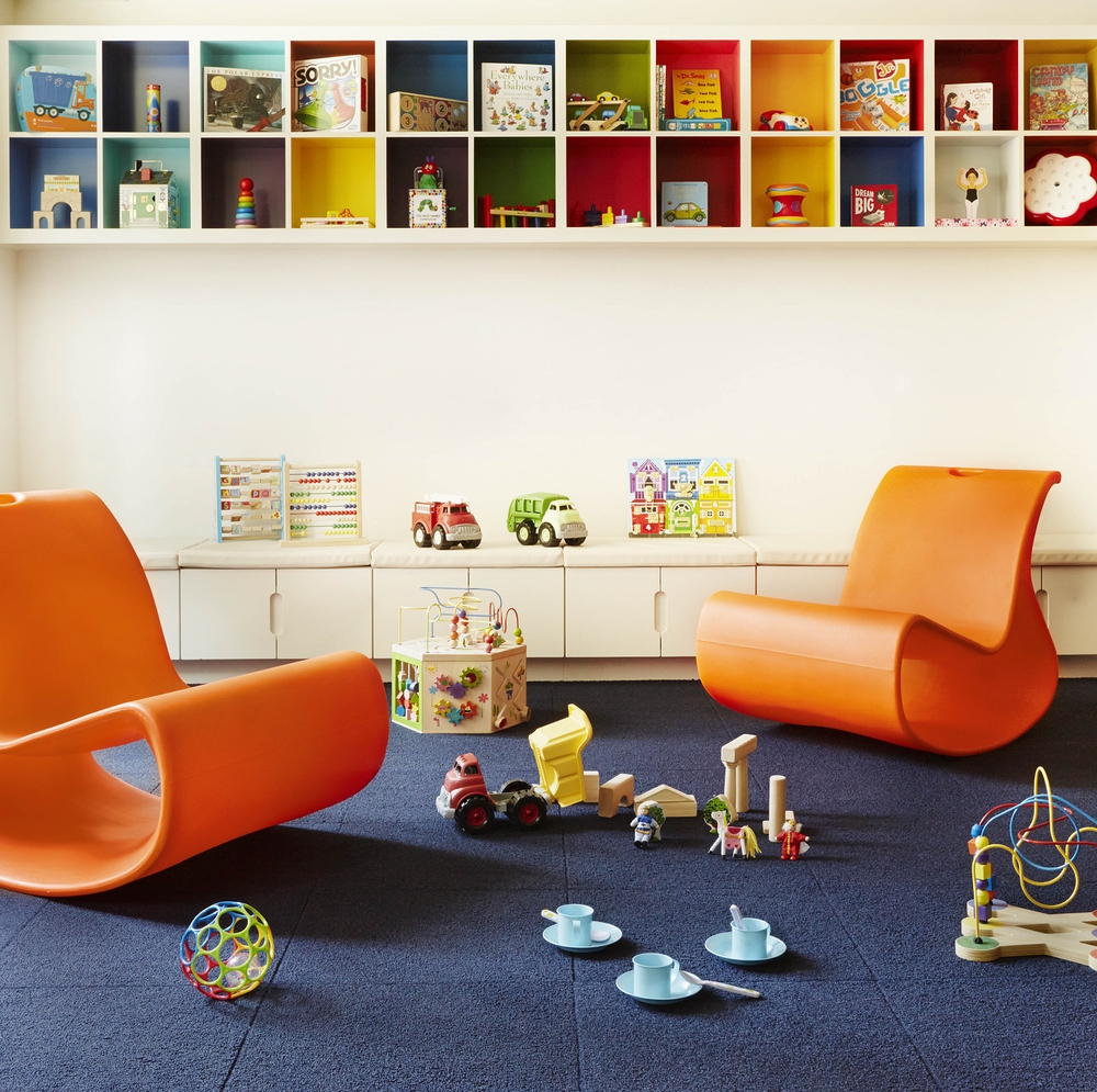 550 West 45th Street, Unit 2513 Manhattan, NY 10036 - Photo 14 of 22 a room with furniture toys and a book shelf