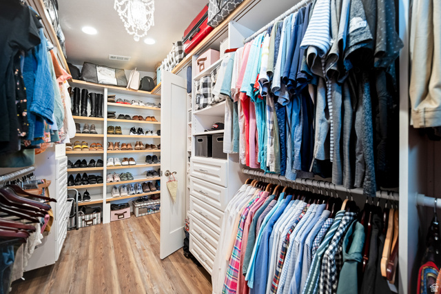 236 West 300 South Hurricane, UT 84737 - Photo 44 of 76 Custom closet system featuring wood-finish flooring, extensive built-in shelving, multiple hanging rods, and integrated drawer storage