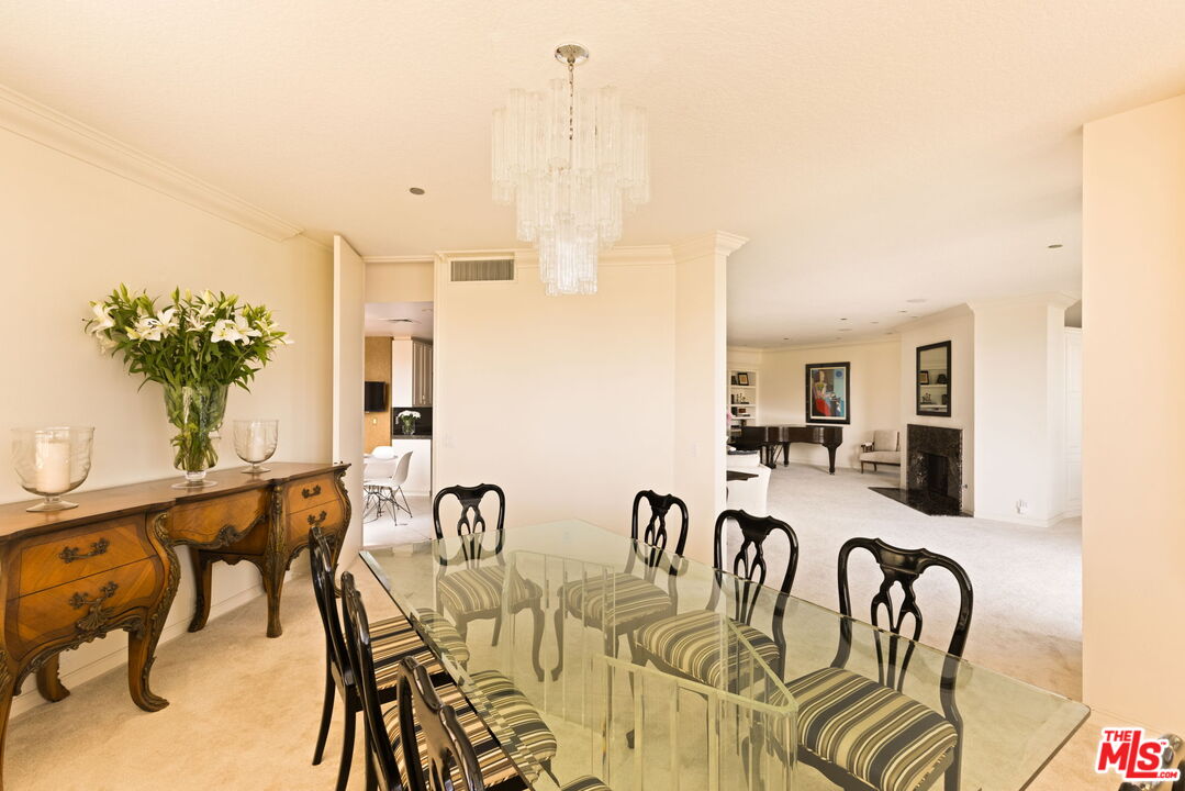 300 North Swall Drive, Unit 353 Beverly Hills, CA 90211 - Photo 11 of 31 a view of a dining room with furniture and a potted plant