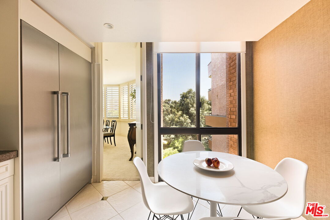 300 North Swall Drive, Unit 353 Beverly Hills, CA 90211 - Photo 14 of 31 a dining room with furniture and window
