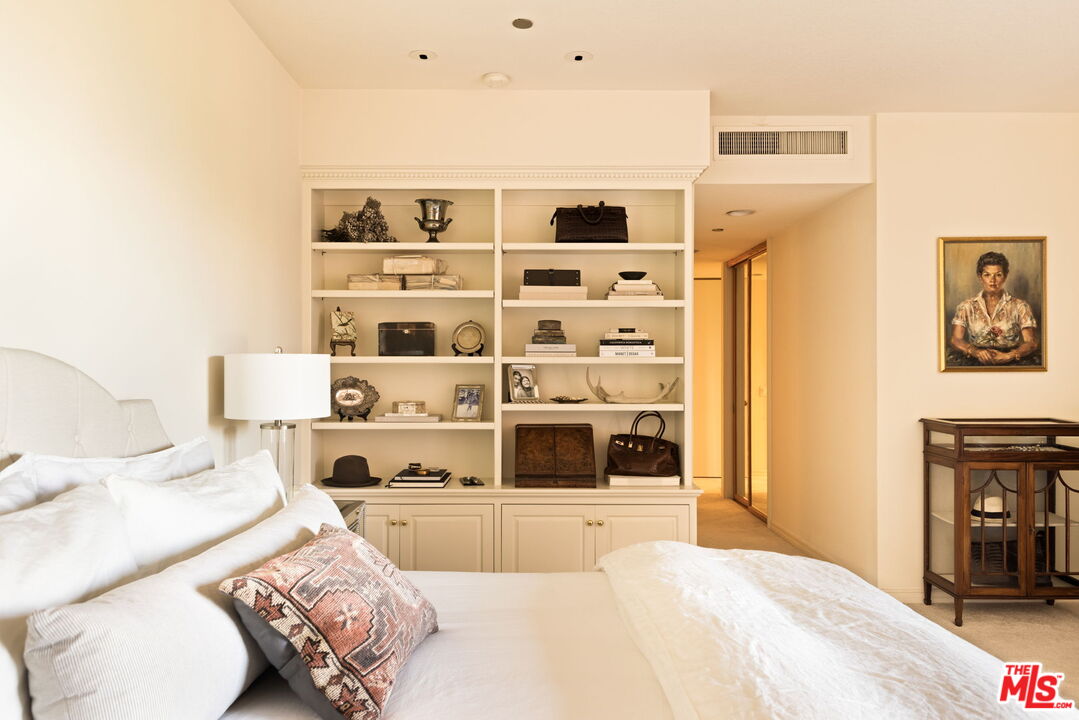 300 North Swall Drive, Unit 353 Beverly Hills, CA 90211 - Photo 19 of 31 a bed room with a bed and a television