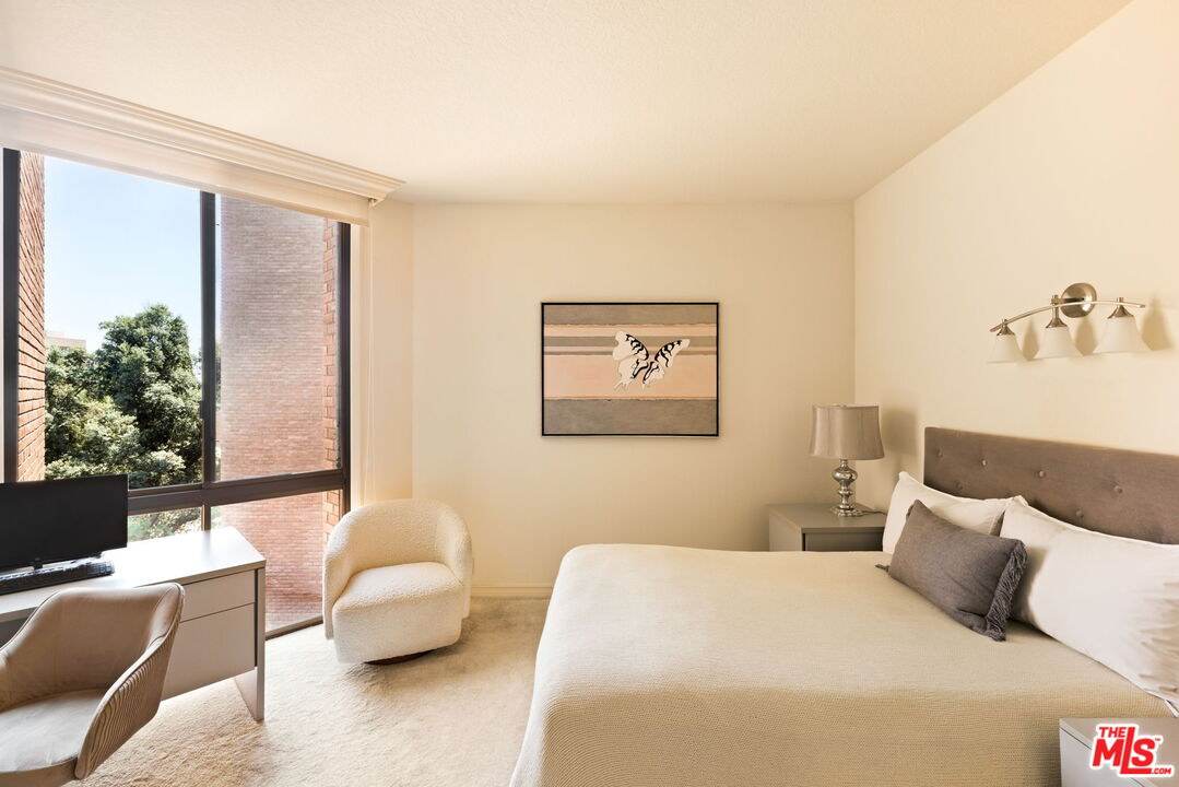 300 North Swall Drive, Unit 353 Beverly Hills, CA 90211 - Photo 23 of 31 a bedroom with a bed couch and a window