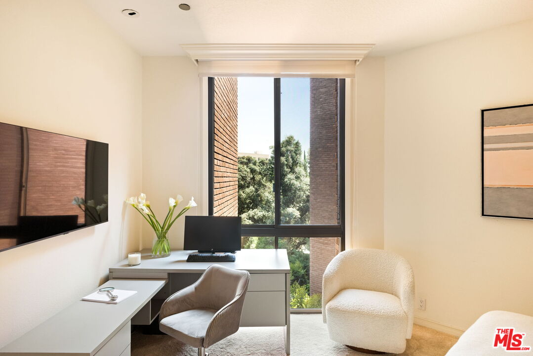 300 North Swall Drive, Unit 353 Beverly Hills, CA 90211 - Photo 24 of 31 a living room with furniture and a flat screen tv