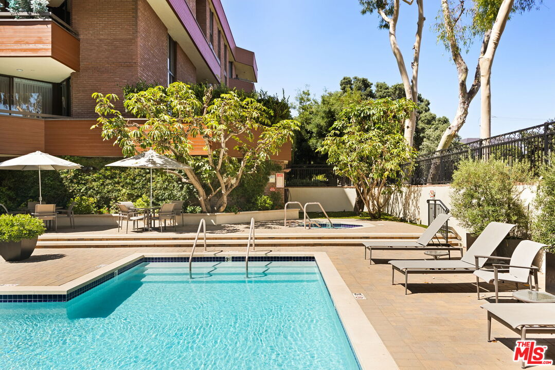 300 North Swall Drive, Unit 353 Beverly Hills, CA 90211 - Photo 30 of 31 swimming pool view with a seating space and a garden