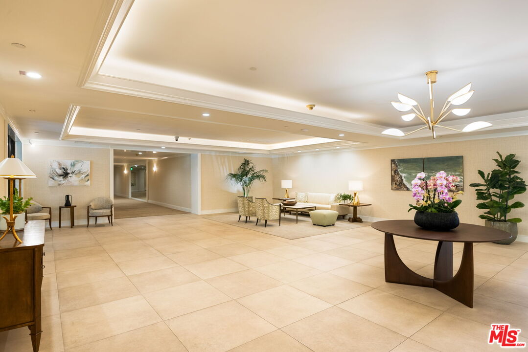 300 North Swall Drive, Unit 353 Beverly Hills, CA 90211 - Photo 3 of 31 a lobby with furniture and a potted plant