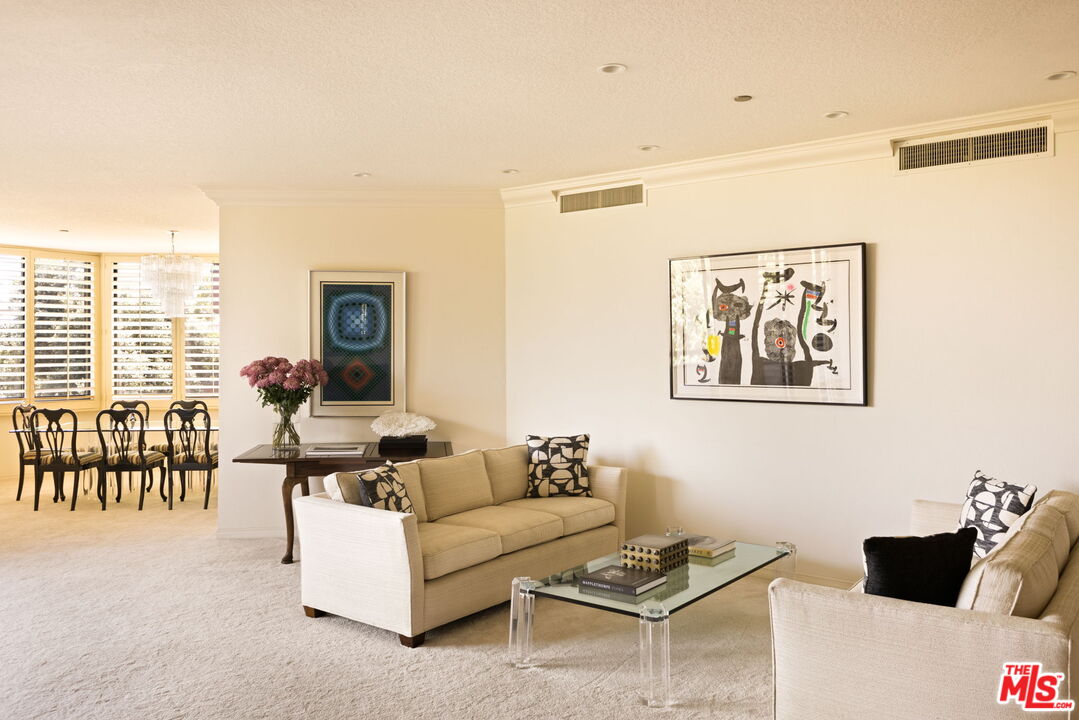 300 North Swall Drive, Unit 353 Beverly Hills, CA 90211 - Photo 8 of 31 a living room with furniture and a large window