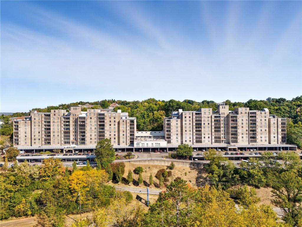 a view of a large building with a large pool