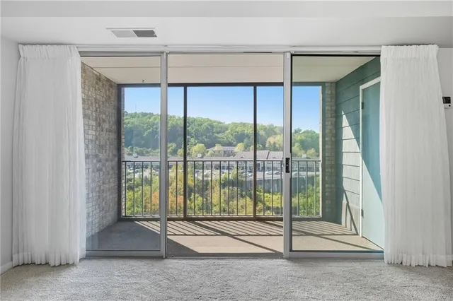 a view of a room with a large window