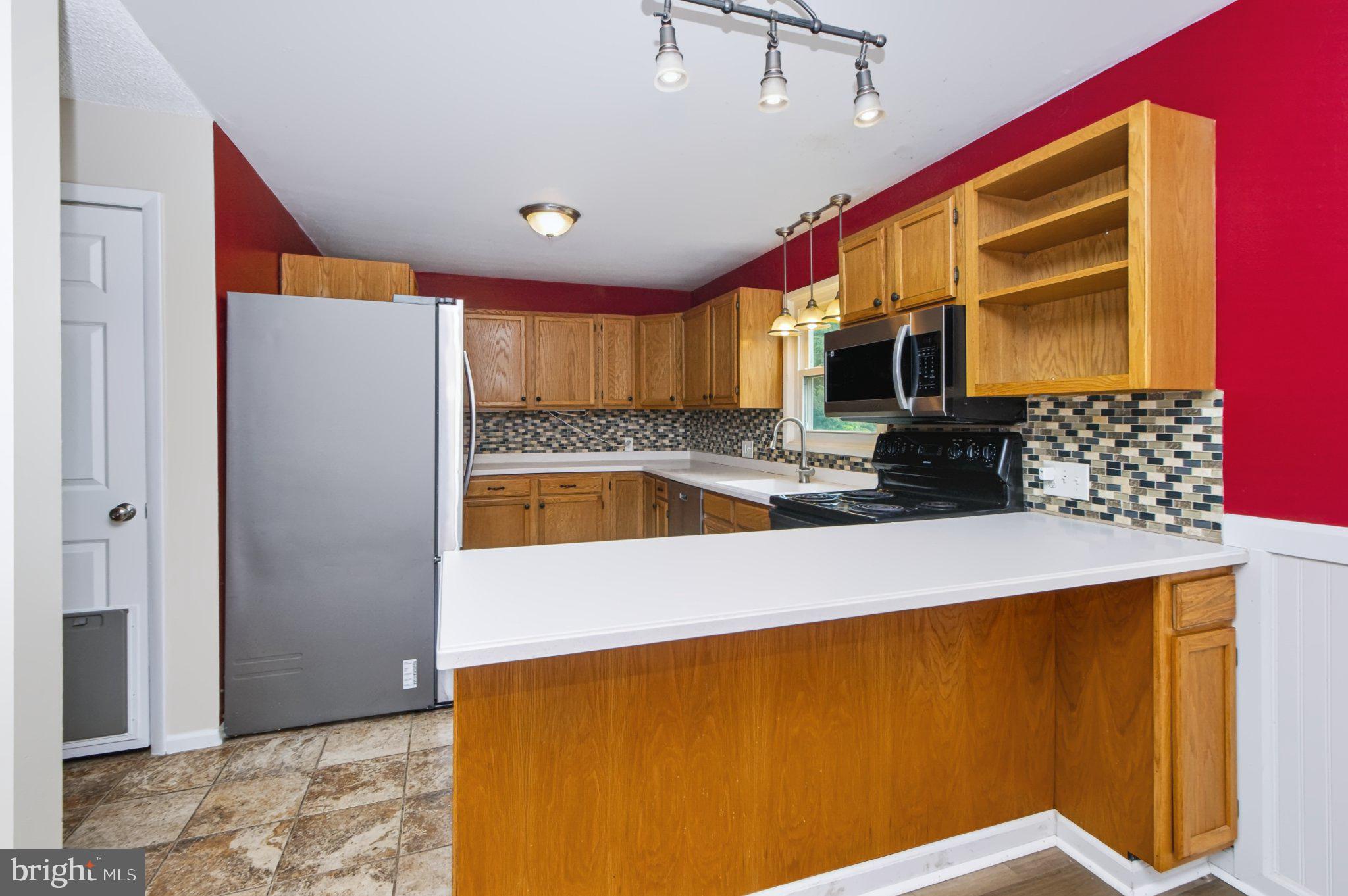 490 Pine Ridge Circle Lewisberry, PA 17339 - Photo 8 of 28 Modern kitchen with vibrant accents.