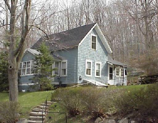 87 Pine Mountain Road Ridgefield, CT 06877 - Photo 1 of 1 front view of a house with a yard
