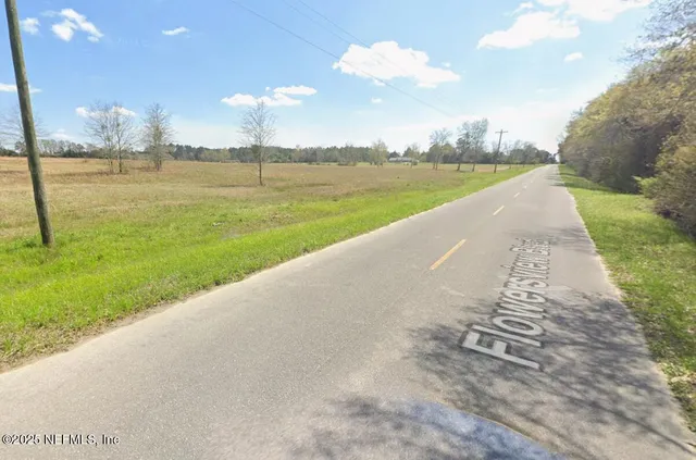 a view of a lake with a big yard