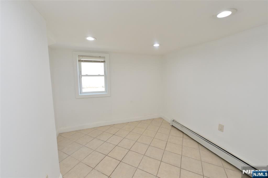 62 Broadway, Unit 1 Hackensack, NJ 07601 - Photo 19 of 25 an empty room with a empty space and window