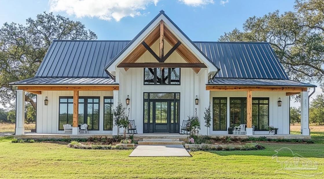 a view of a house with sitting area and swimming pool