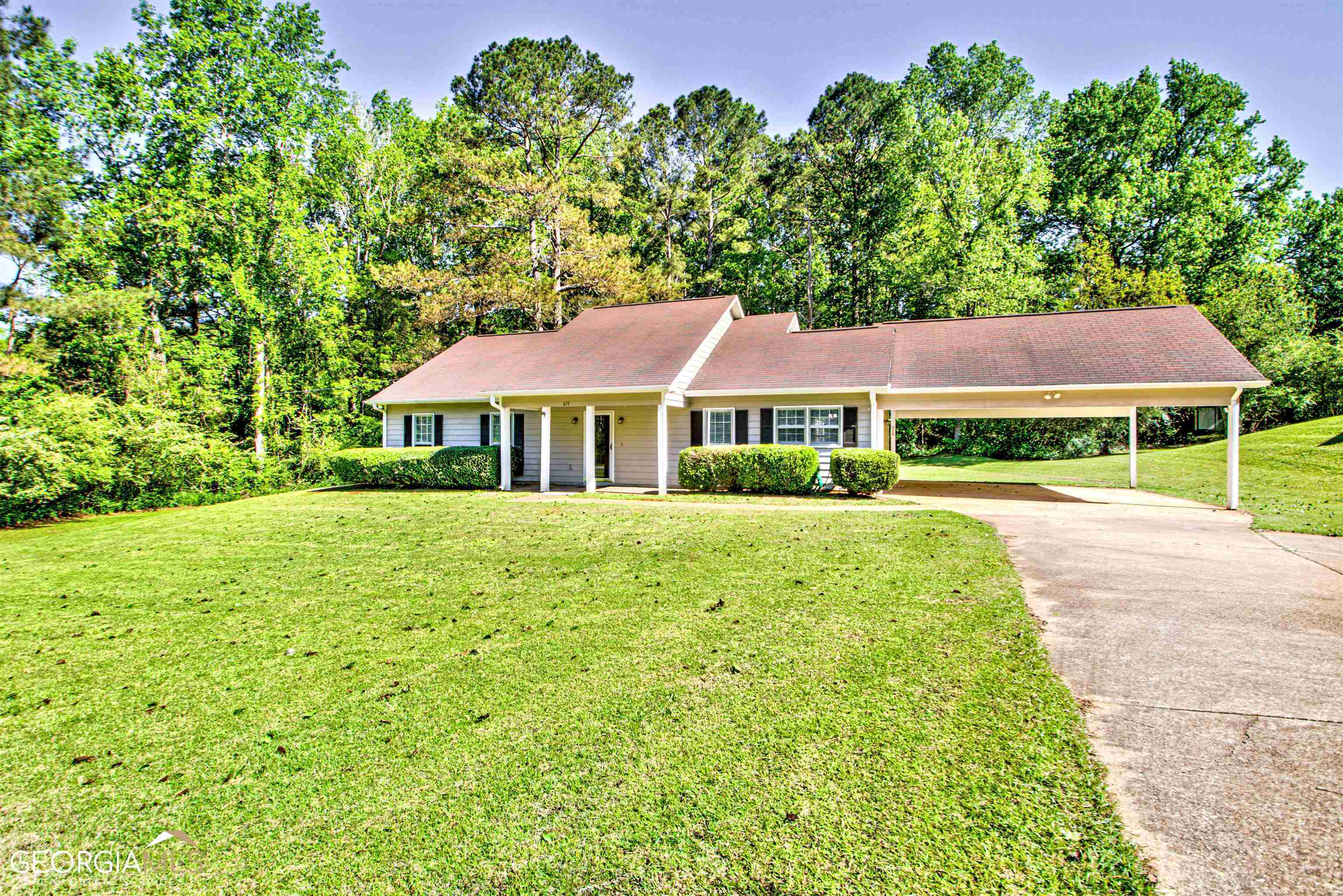 a view of house with yard