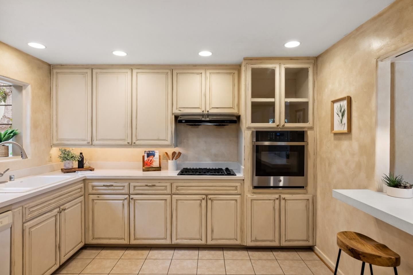 777 Parcel Street Monterey, CA 93940 - Photo 10 of 21 a kitchen with a sink window and cabinets