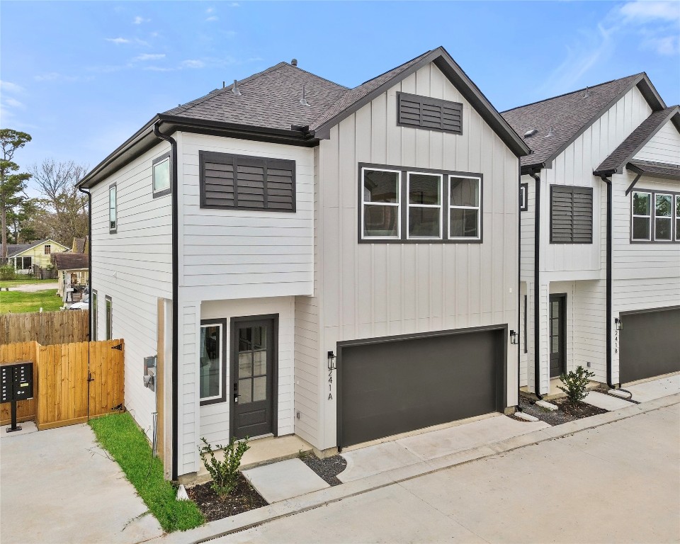 243 Rebecca Street, Unit F Houston, TX 77022 - Photo 1 of 26 a front view of a house with garage