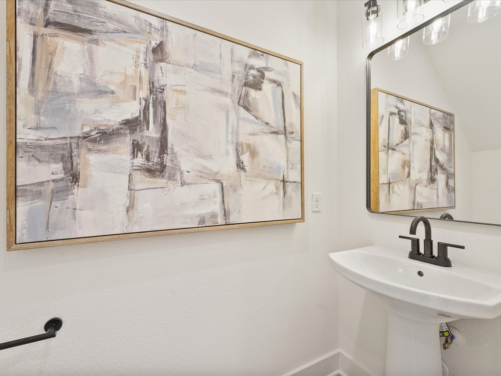 243 Rebecca Street, Unit F Houston, TX 77022 - Photo 12 of 26 a bathroom with a sink and mirror
