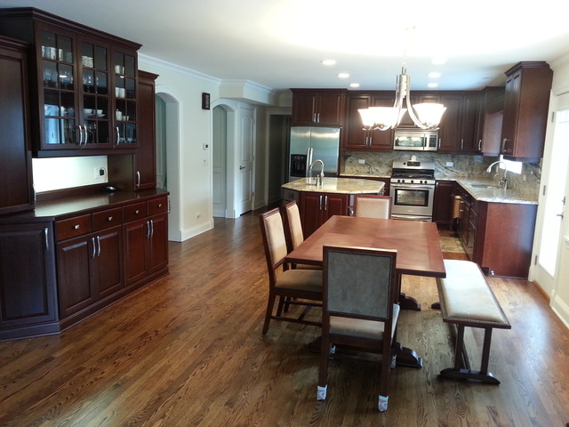 1718 Appleby Road Inverness, IL 60067 - Photo 4 of 24 a dining room with wooden floor a glass table and chairs