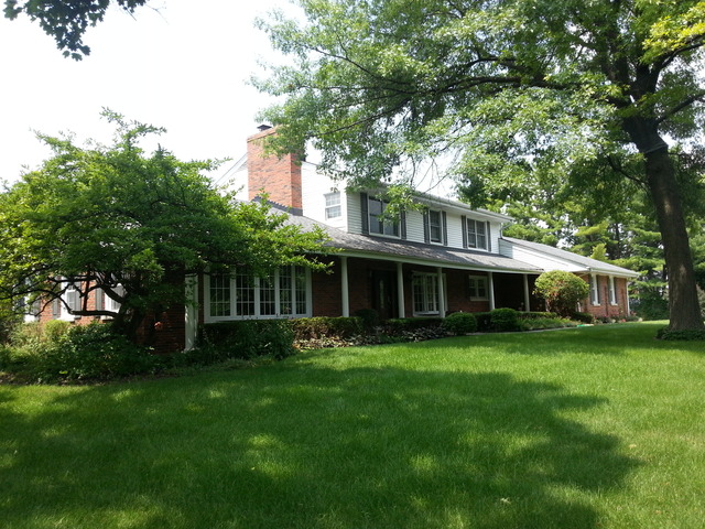 1718 Appleby Road Inverness, IL 60067 - Photo 10 of 24 front view of a house with a garden
