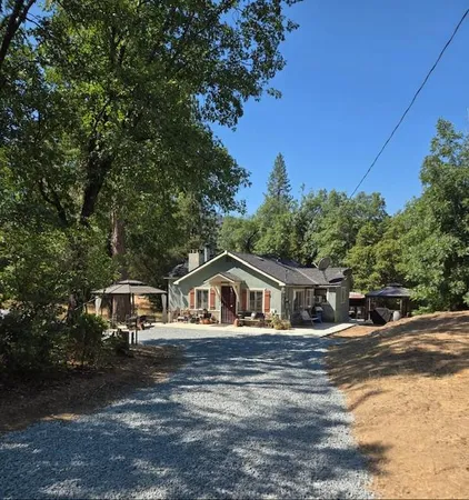a house with trees in the background