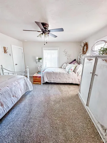 a bedroom with bed and mirror