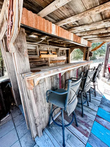 a view of a chairs and table on the deck