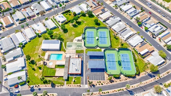an aerial view of a house with a swimming pool