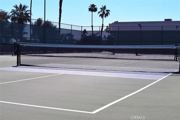 a view of a swimming pool with outdoor seating