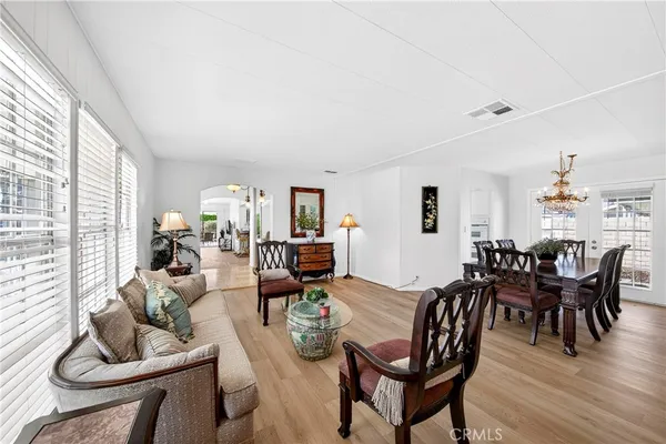 a view of a dining room with furniture and wooden floor