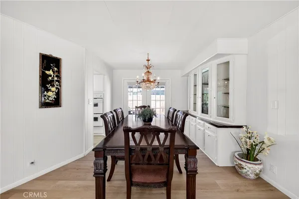 a view of a dining room with furniture and window