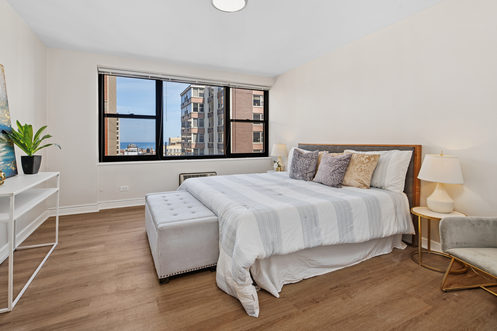 850 North Dewitt Place, Unit 18G Chicago, IL 60611 - Photo 11 of 23 a bedroom with a bed and window