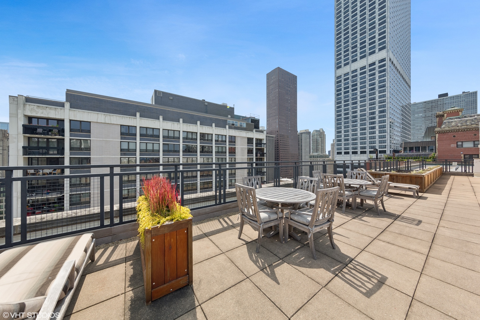 850 North Dewitt Place, Unit 18G Chicago, IL 60611 - Photo 18 of 23 a view of balcony with chairs and with potted plant
