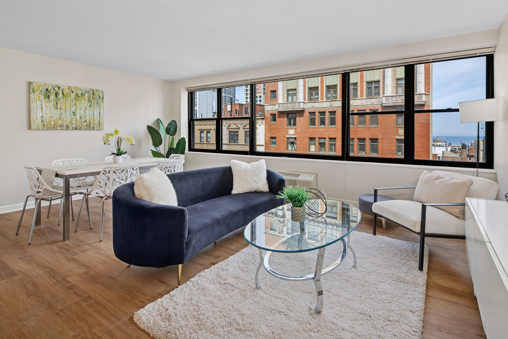 850 North Dewitt Place, Unit 18G Chicago, IL 60611 - Photo 3 of 23 a living room with furniture and a window