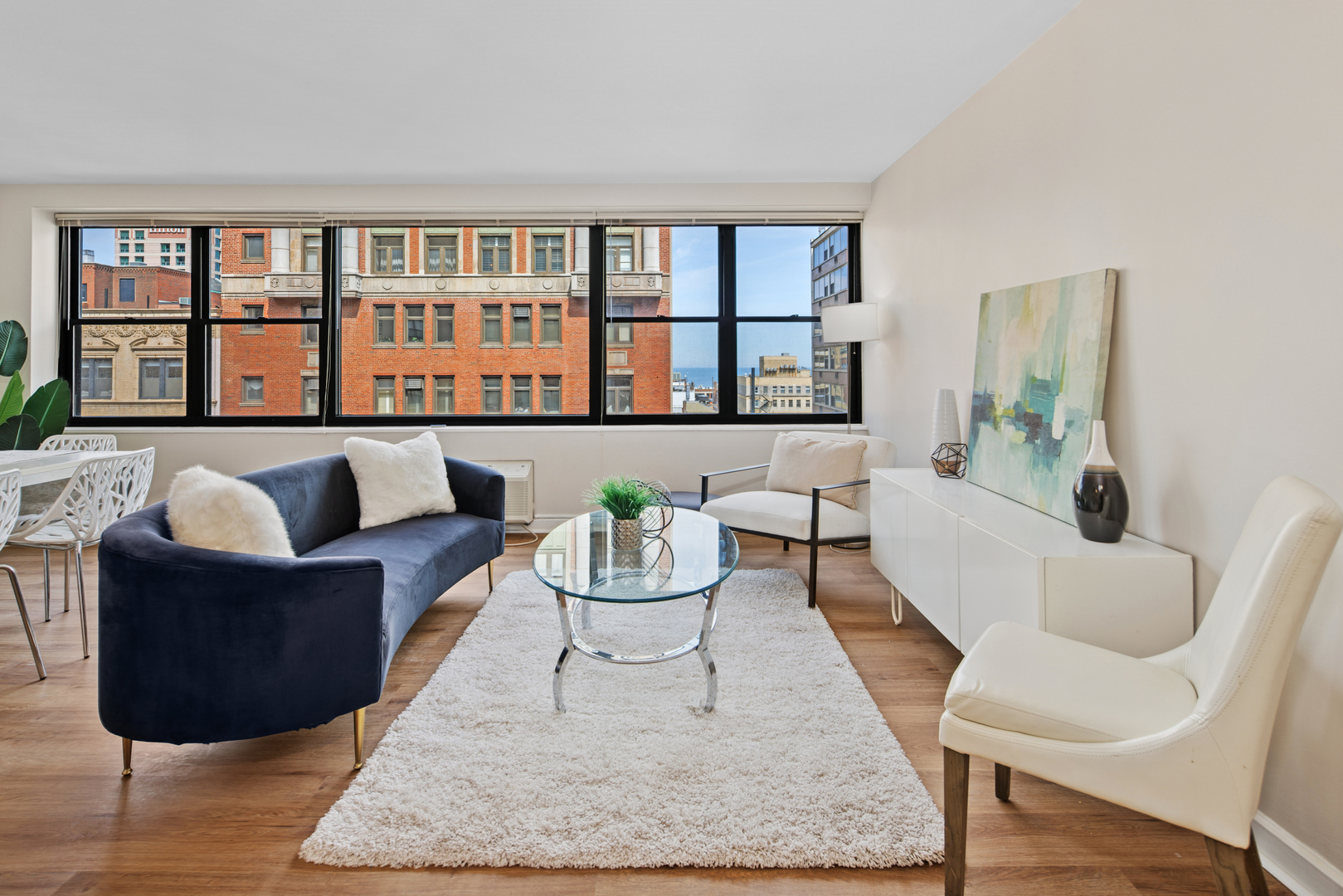 850 North Dewitt Place, Unit 18G Chicago, IL 60611 - Photo 4 of 23 a living room with furniture rug and window