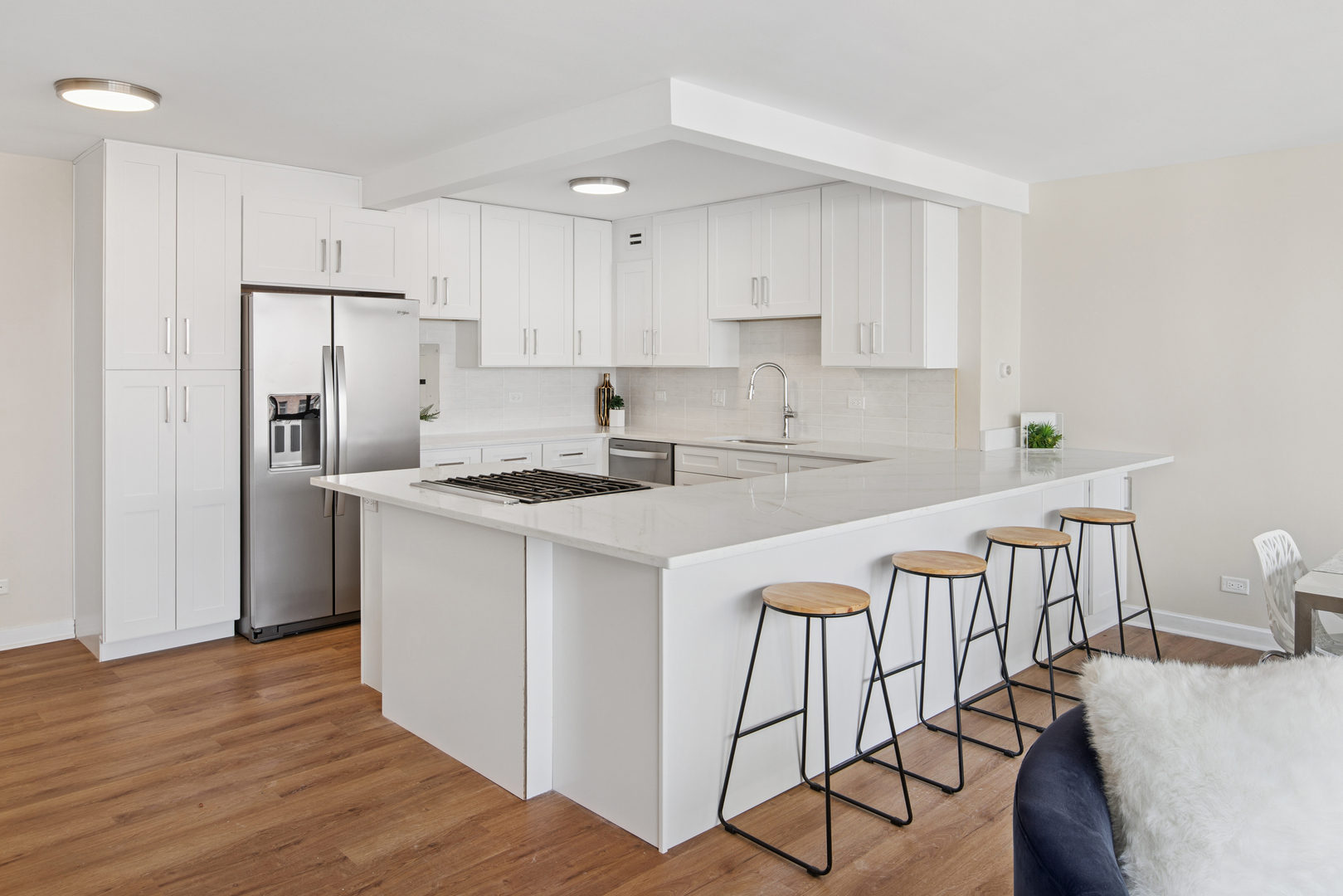 850 North Dewitt Place, Unit 18G Chicago, IL 60611 - Photo 7 of 23 a kitchen that has a lot of white cabinets and stainless steel appliances