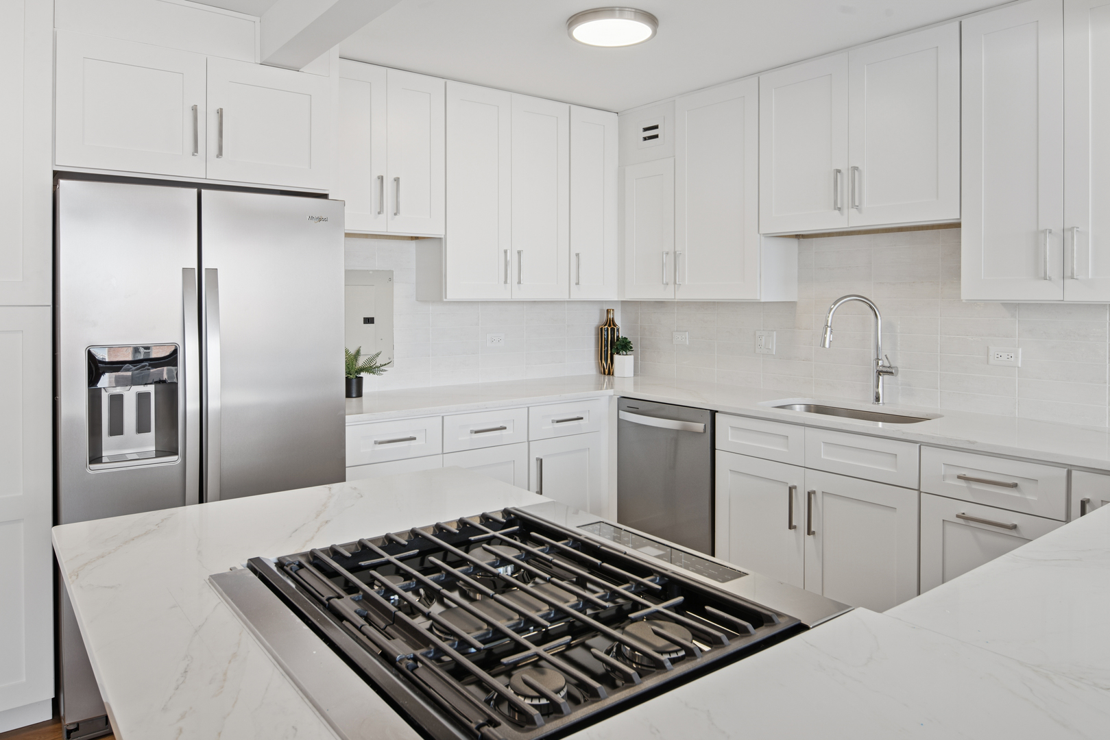 850 North Dewitt Place, Unit 18G Chicago, IL 60611 - Photo 10 of 23 a kitchen with white cabinets and appliances