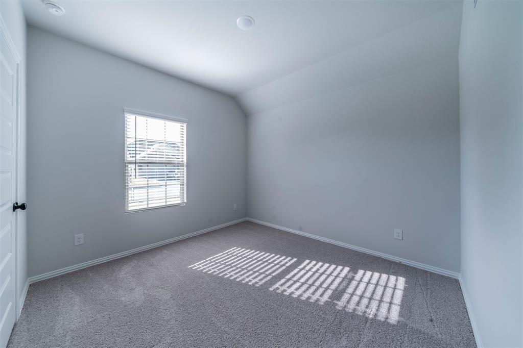 516 Ridgewood Drive Van Alstyne, TX 75495 - Photo 14 of 25 an empty room with windows