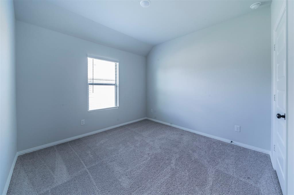 516 Ridgewood Drive Van Alstyne, TX 75495 - Photo 17 of 25 an empty room with a window