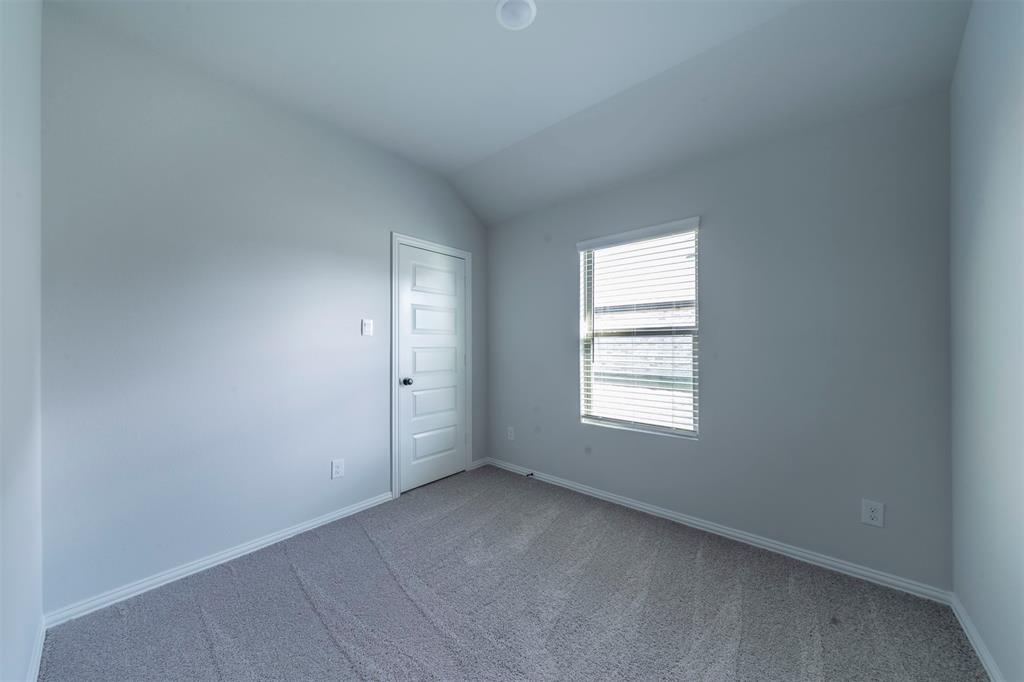 516 Ridgewood Drive Van Alstyne, TX 75495 - Photo 19 of 25 an empty room with windows
