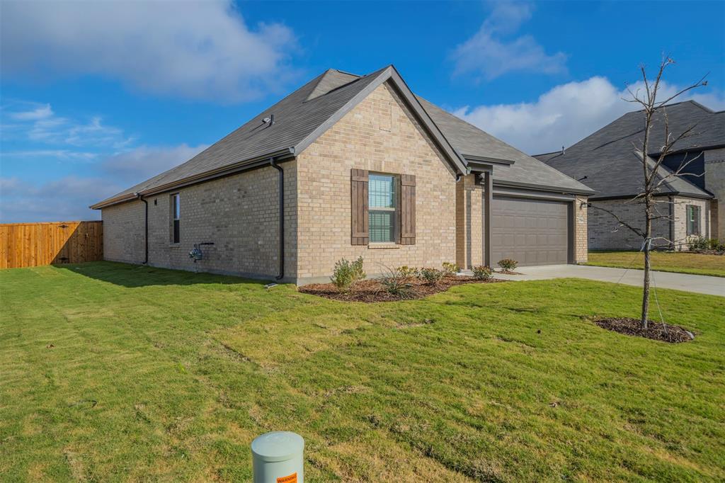 516 Ridgewood Drive Van Alstyne, TX 75495 - Photo 22 of 25 a view of house with backyard