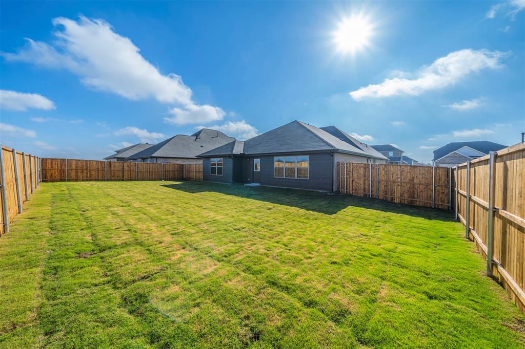 516 Ridgewood Drive Van Alstyne, TX 75495 - Photo 23 of 25 a view of a house with a yard
