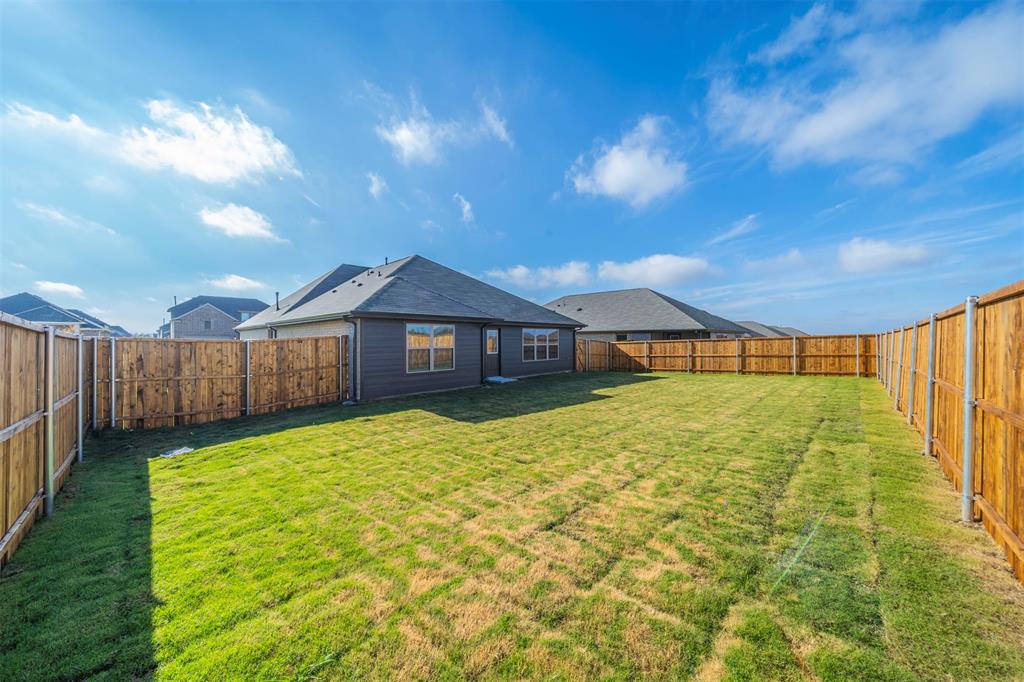 516 Ridgewood Drive Van Alstyne, TX 75495 - Photo 25 of 25 a view of a house with a yard