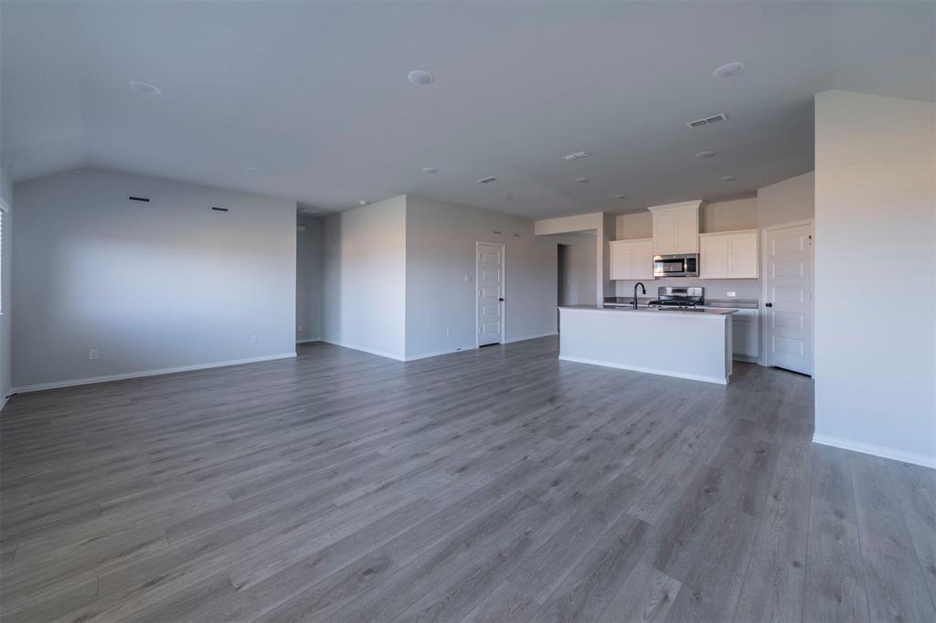 516 Ridgewood Drive Van Alstyne, TX 75495 - Photo 4 of 25 a view of a kitchen with a sink and a stove top oven