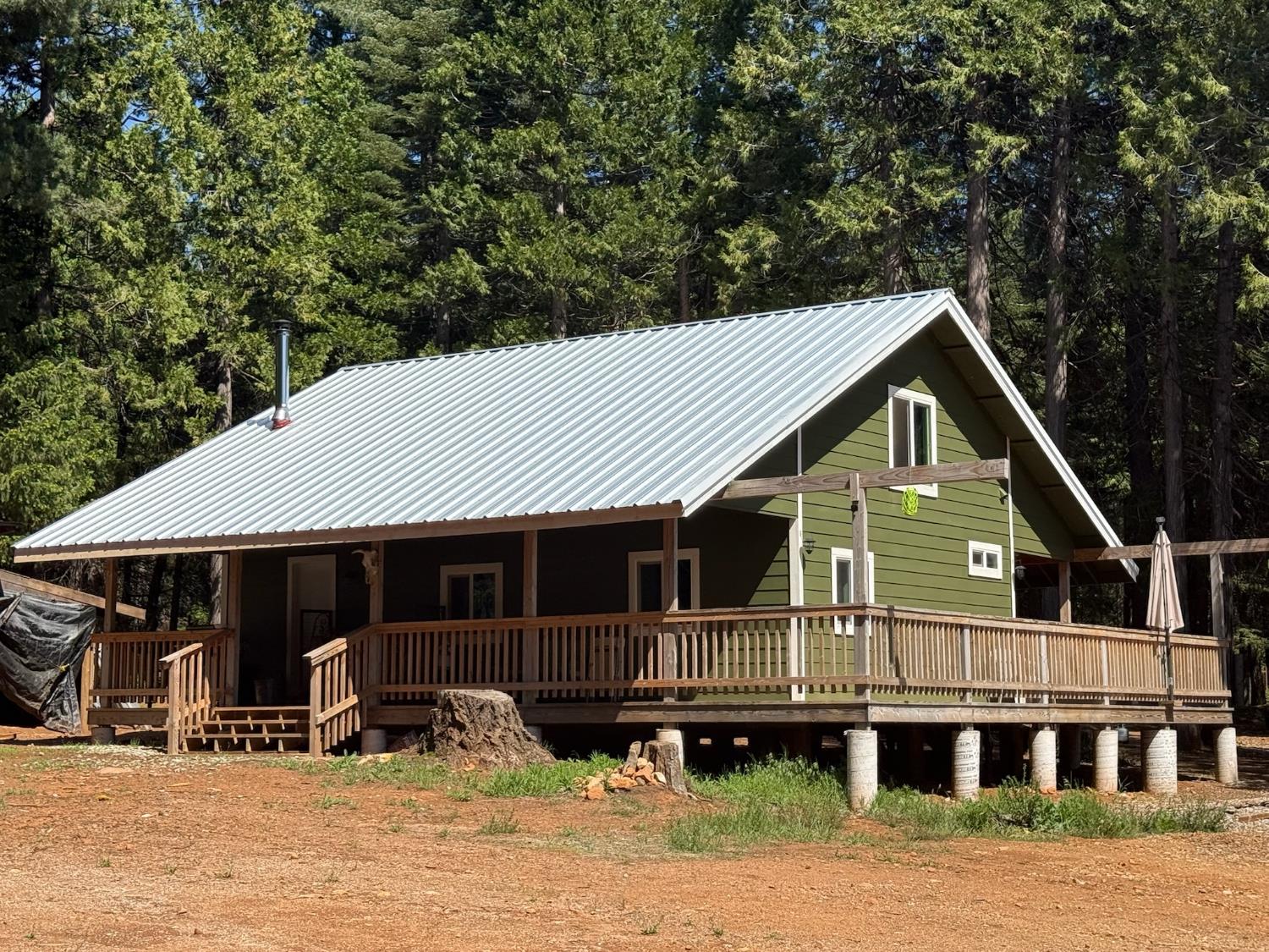 a front view of a house with yard and seating area