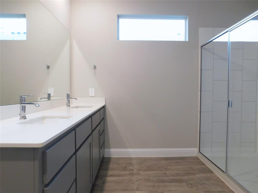1708 Buzzard Road Denton, TX 76205 - Photo 12 of 28 a bathroom with a sink and a mirror