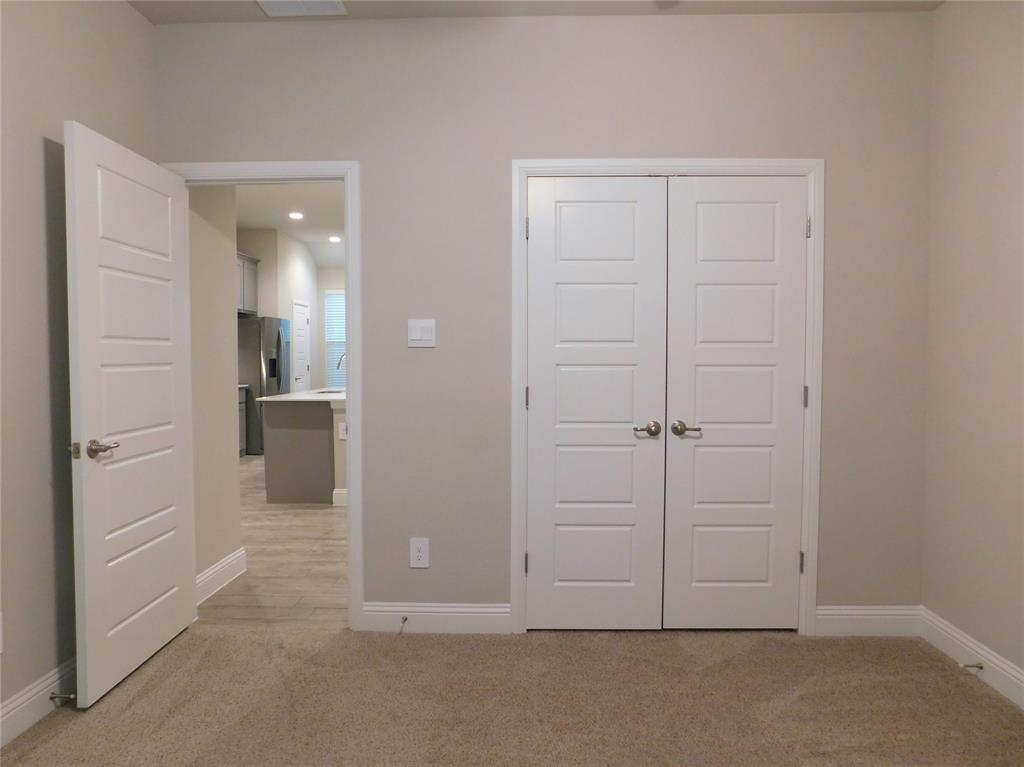 1708 Buzzard Road Denton, TX 76205 - Photo 15 of 28 an empty room with cabinet and mirrors
