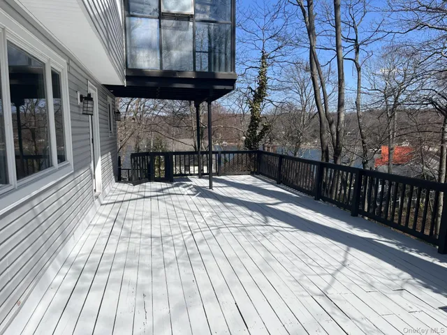 a view of a brick house with a large window
