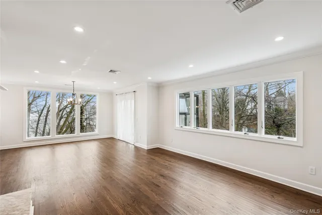 a kitchen with stainless steel appliances a refrigerator stove microwave and sink
